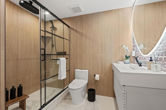 bathroom with vanity, toilet, and an enclosed shower