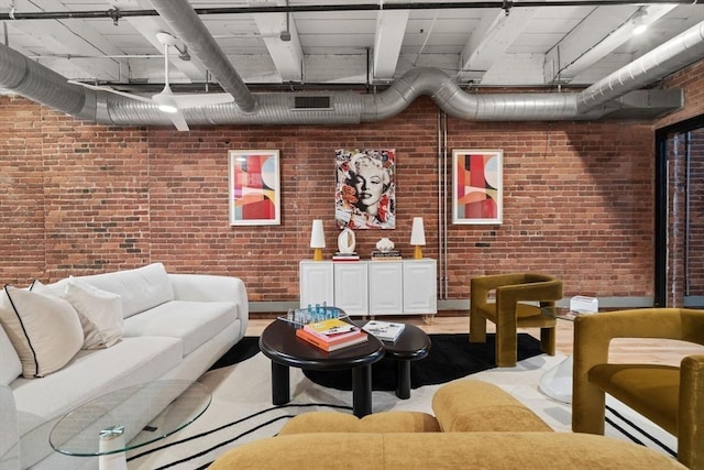 living room with brick wall