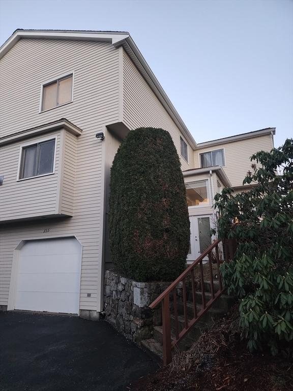 view of side of property featuring a garage