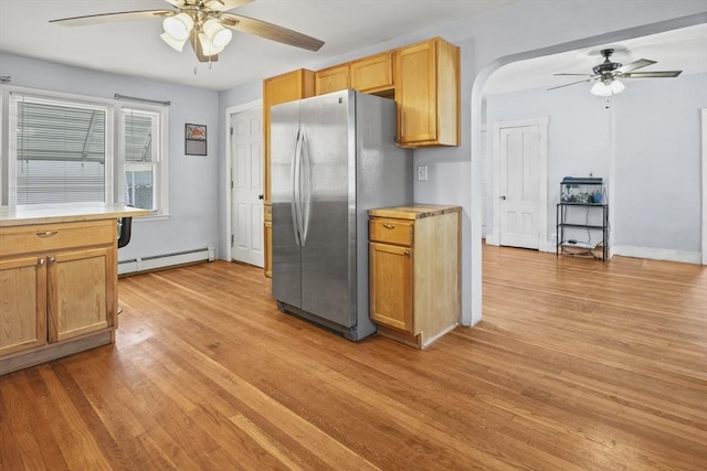40 By St, Lowell, MA 01850 - kitchen with ceiling fan, freestanding refrigerator, baseboard heating, light wood-style floors, and arched walkways