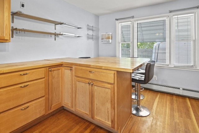 40 By St, Lowell, MA 01850 - kitchen featuring butcher block countertops, open shelves, wood finished floors, a kitchen breakfast bar, and a desk