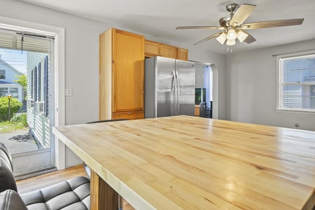 40 By St, Lowell, MA 01850 - kitchen with freestanding refrigerator, plenty of natural light, ceiling fan, and wood finished floors