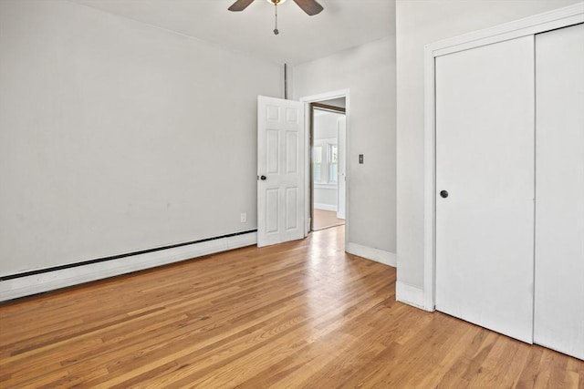 40 By St, Lowell, MA 01850 - unfurnished bedroom with light wood-style floors, baseboard heating, a closet, and a ceiling fan