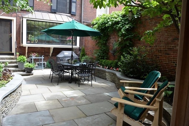 view of patio featuring entry steps and outdoor dining space