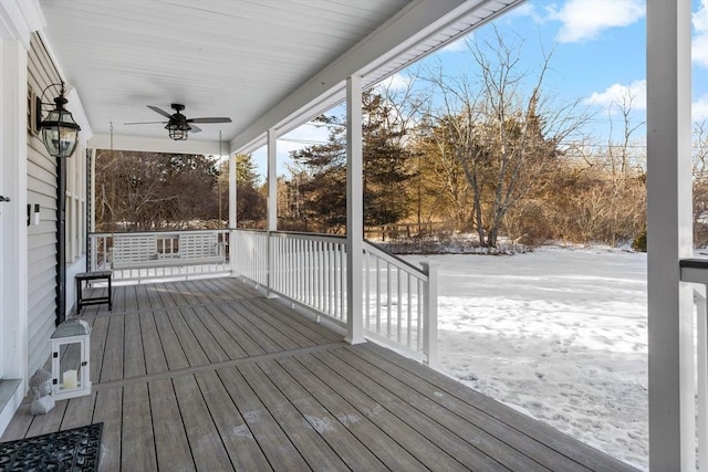 snow covered deck featuring a ceiling fan