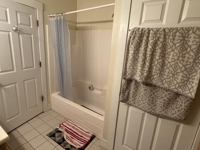 full bath featuring shower / bath combo with shower curtain and tile patterned flooring