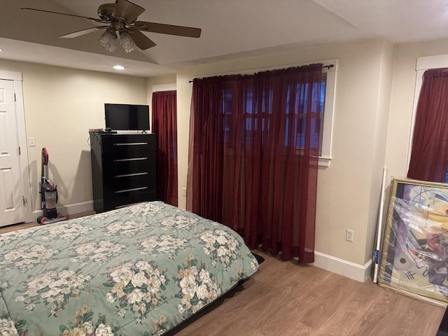 bedroom featuring recessed lighting, a ceiling fan, baseboards, and wood finished floors