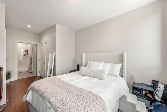 bedroom featuring wood finished floors and recessed lighting