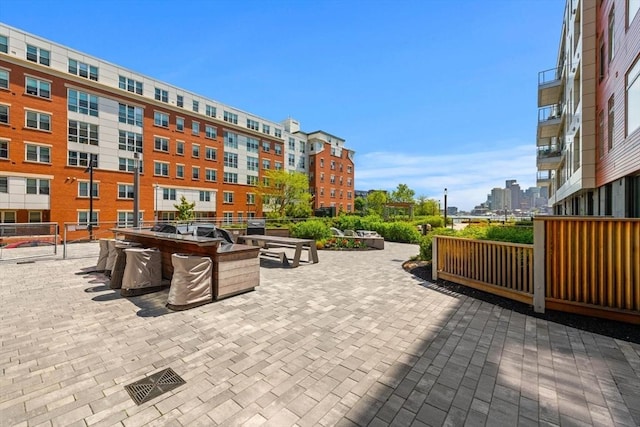 view of patio / terrace featuring a city view