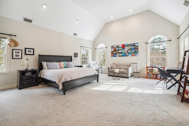 bedroom with light carpet, high vaulted ceiling, and multiple windows