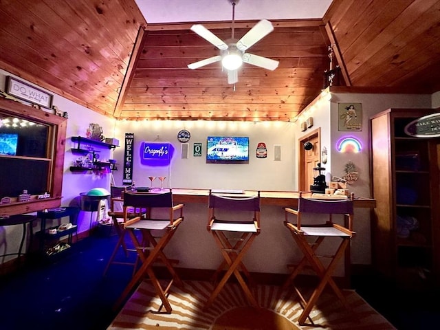 bar with wood ceiling, ceiling fan, and vaulted ceiling