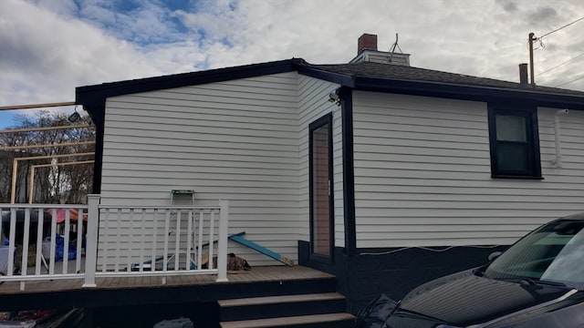 view of home's exterior featuring a deck