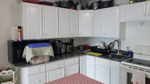 kitchen with white cabinets, sink, and white electric stove