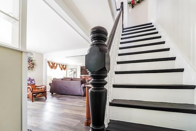 stairs with wood finished floors