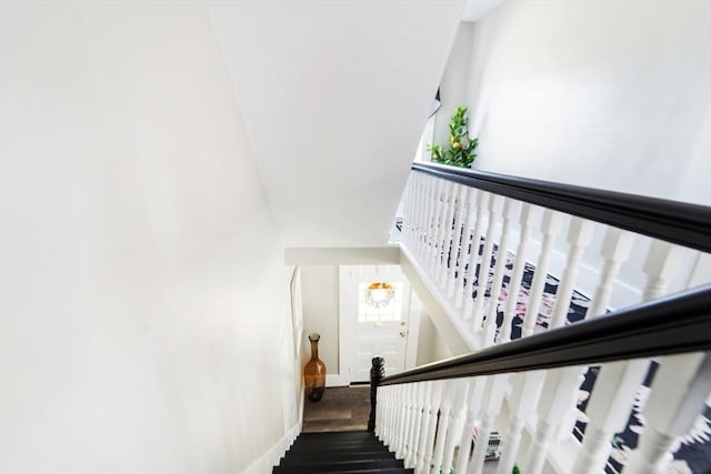 stairway featuring wood finished floors