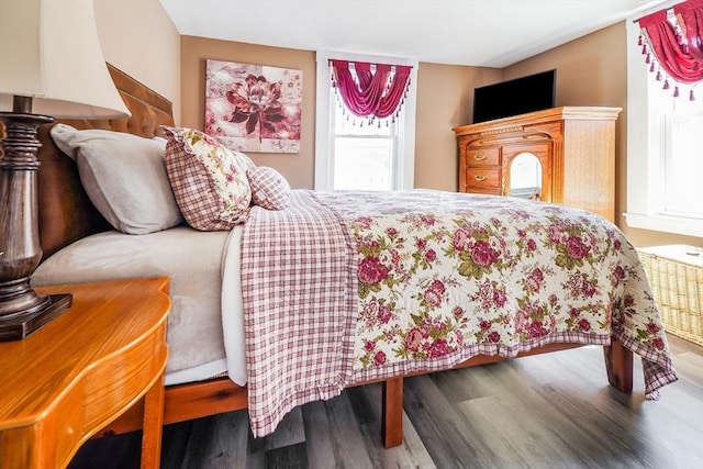 bedroom featuring wood finished floors
