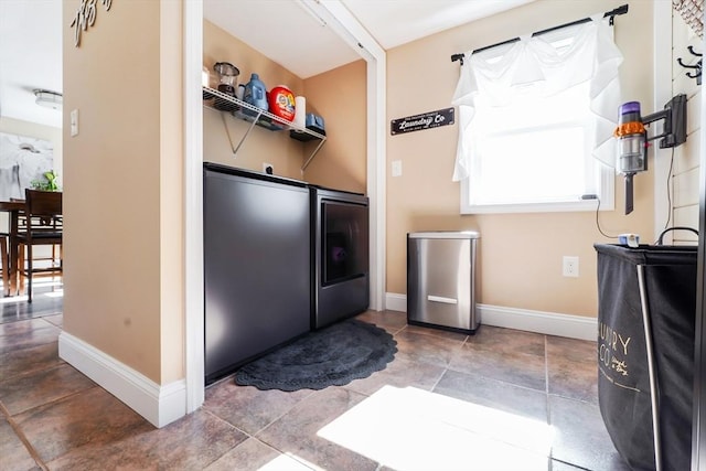 laundry room featuring baseboards