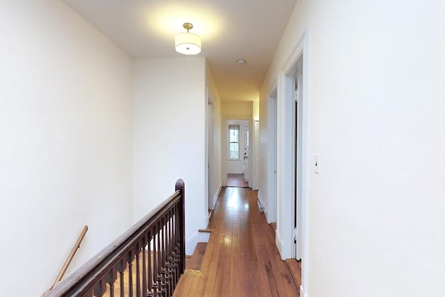 corridor featuring wood-type flooring