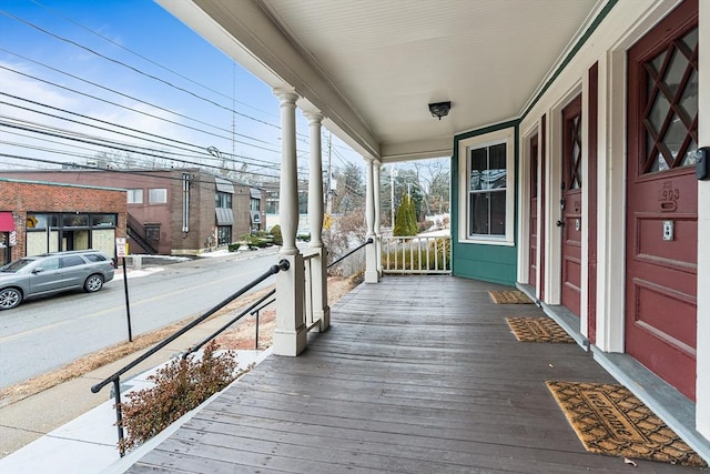 wooden terrace featuring a porch