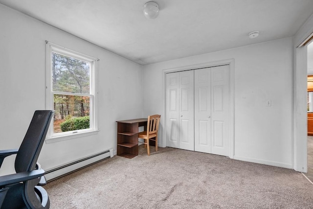 office area featuring baseboards, a baseboard heating unit, and carpet flooring