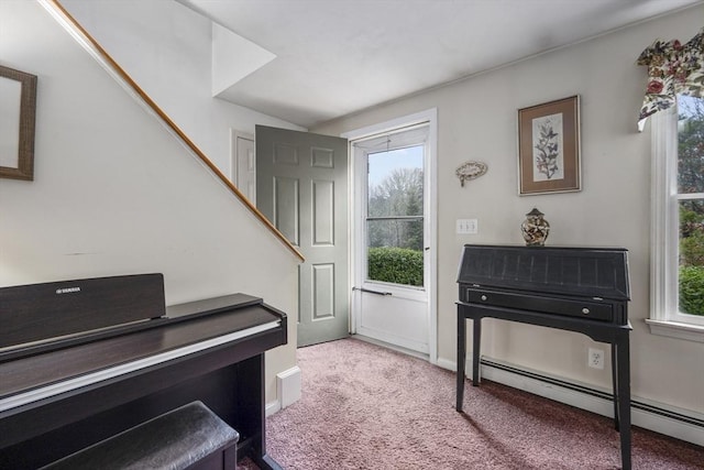 carpeted foyer entrance featuring a baseboard radiator and baseboards