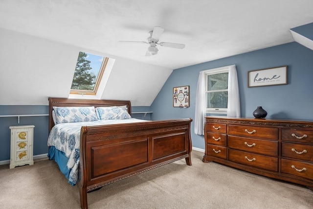 bedroom featuring baseboards, lofted ceiling, a ceiling fan, and light carpet