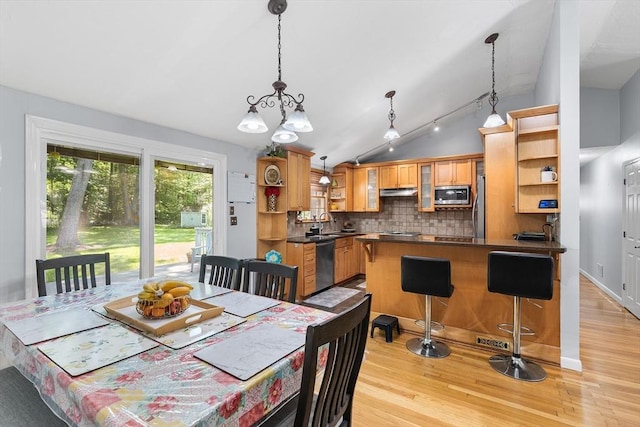 206 Cordaville Rd, Southborough, MA 01772 - dining space featuring light wood finished floors, lofted ceiling, and a chandelier