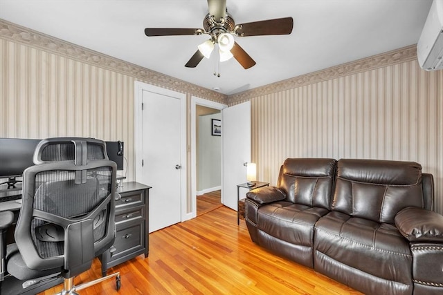 office with ceiling fan, hardwood / wood-style floors, and a wall unit AC