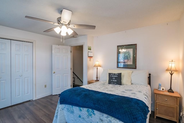 bedroom featuring a closet, baseboards, ceiling fan, and dark wood-style floors