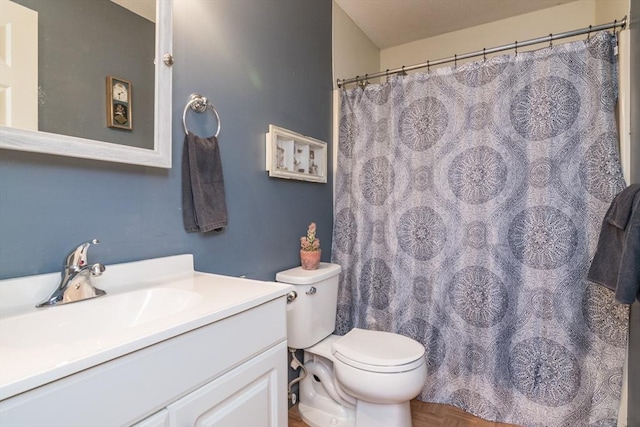 full bath with vanity and toilet
