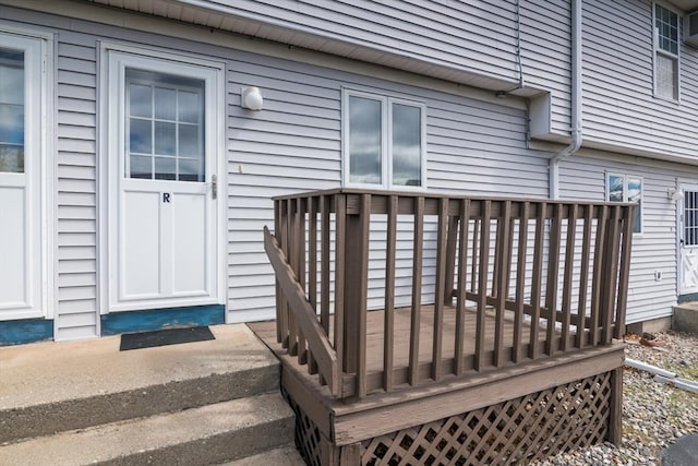 doorway to property featuring a wooden deck
