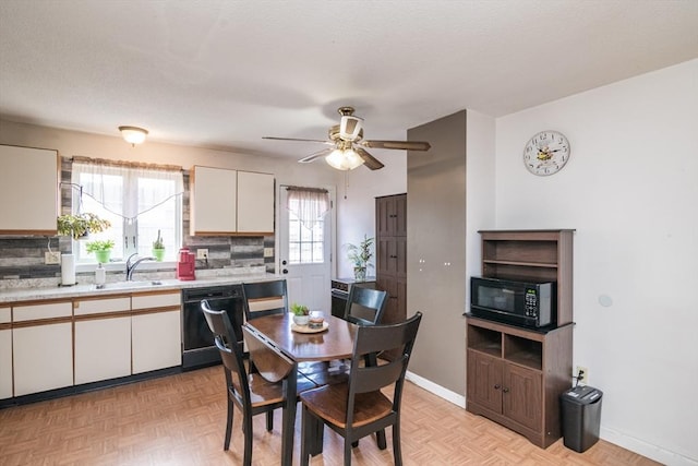 dining area with baseboards and a ceiling fan