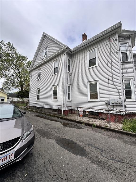 view of property exterior with a chimney