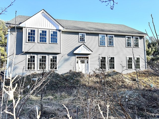 view of front of house featuring board and batten siding and a shingled roof