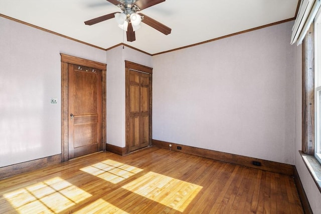 unfurnished bedroom featuring ornamental molding, ceiling fan, and light hardwood / wood-style flooring