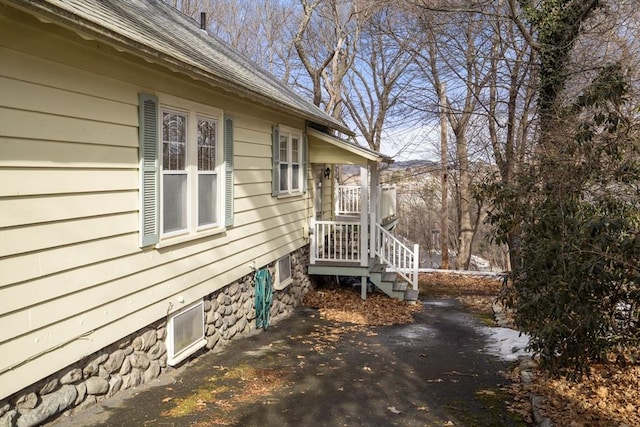 view of side of property featuring a patio area