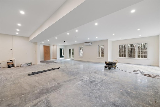 interior space featuring recessed lighting and a wall unit AC