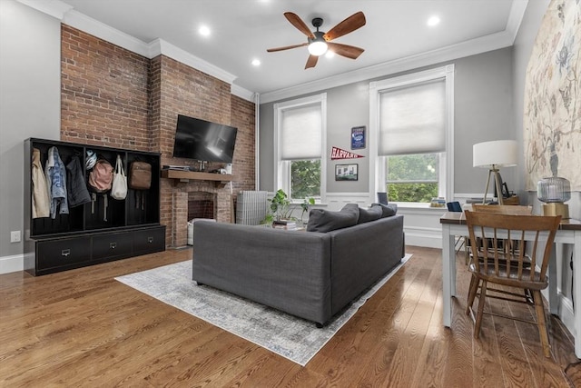 1411 Washington St Unit 4, Boston, MA 02118 - living area featuring a ceiling fan, wood finished floors, a brick fireplace, ornamental molding, and recessed lighting