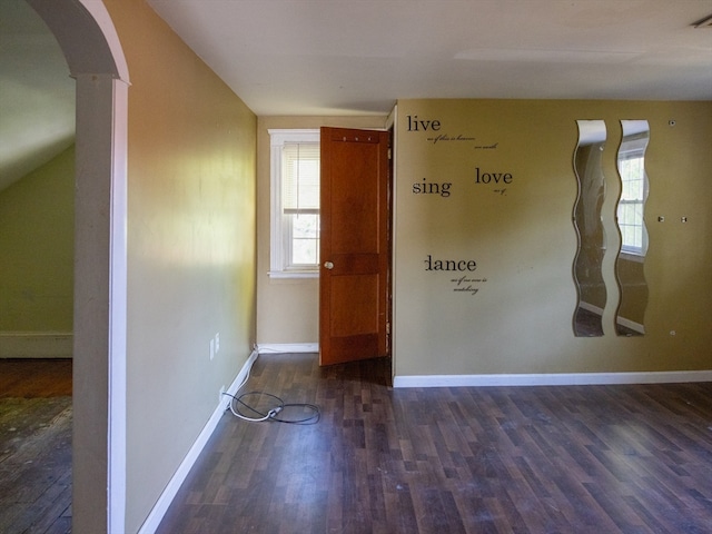 empty room featuring dark wood-type flooring