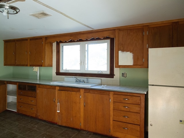 kitchen with white fridge and sink