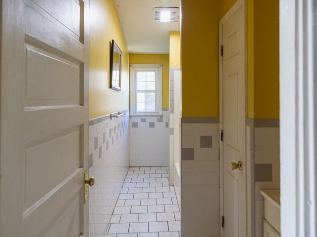 bathroom featuring tile walls and tile patterned flooring