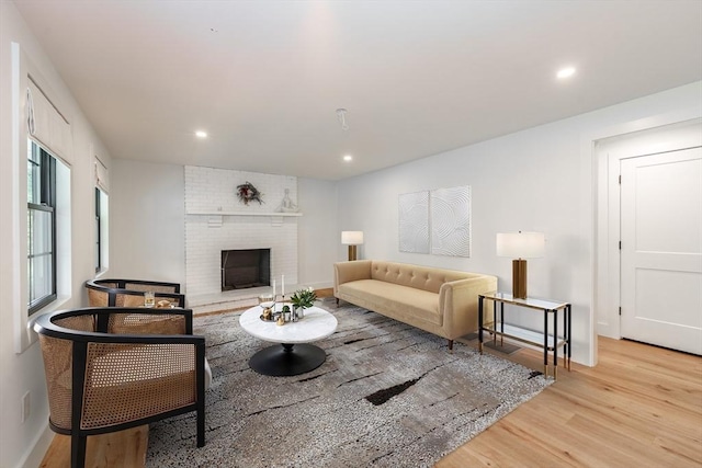 6 Hitching Post Ln, Wilbraham, MA 01095 - living area featuring wood finished floors, recessed lighting, a brick fireplace, and baseboards