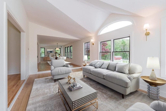 6 Hitching Post Ln, Wilbraham, MA 01095 - living room with light wood finished floors, lofted ceiling, and baseboards