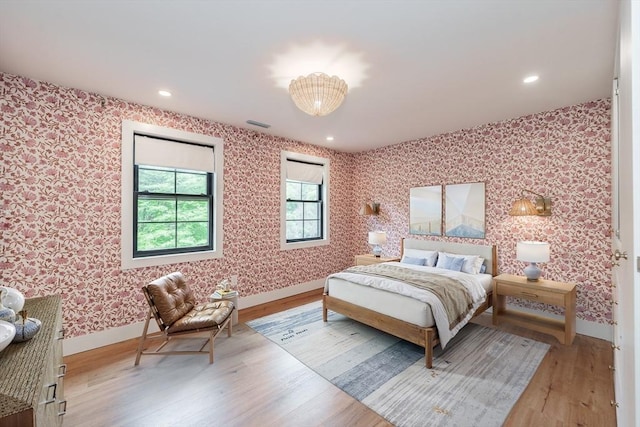 6 Hitching Post Ln, Wilbraham, MA 01095 - bedroom with wallpapered walls, wood finished floors, baseboards, and recessed lighting