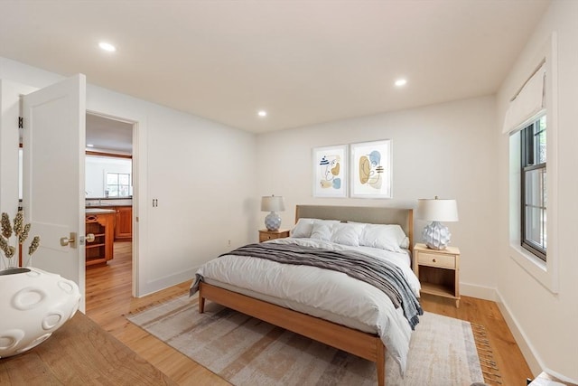 6 Hitching Post Ln, Wilbraham, MA 01095 - bedroom with light wood finished floors, multiple windows, recessed lighting, and baseboards