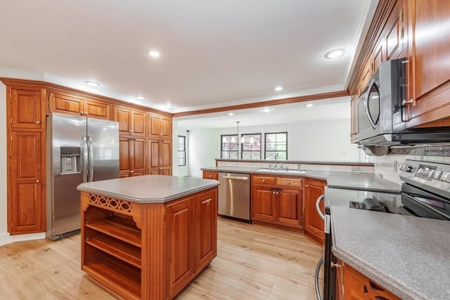 6 Hitching Post Ln, Wilbraham, MA 01095 - kitchen with appliances with stainless steel finishes, a sink, brown cabinetry, a peninsula, and recessed lighting