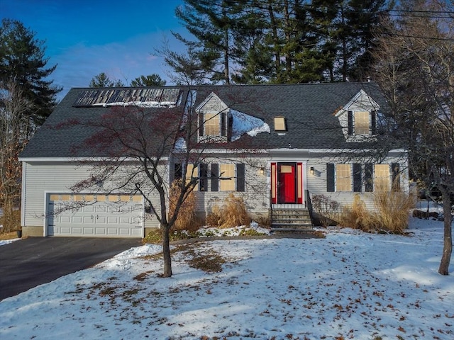 cape cod-style house with a garage