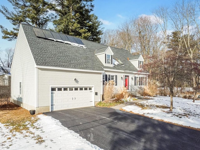 cape cod house with a garage