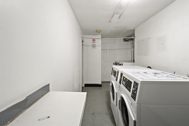 12 Commonwealth Ct Unit 12-16, Boston, MA 02135 - community laundry room featuring washing machine and dryer and dark floors