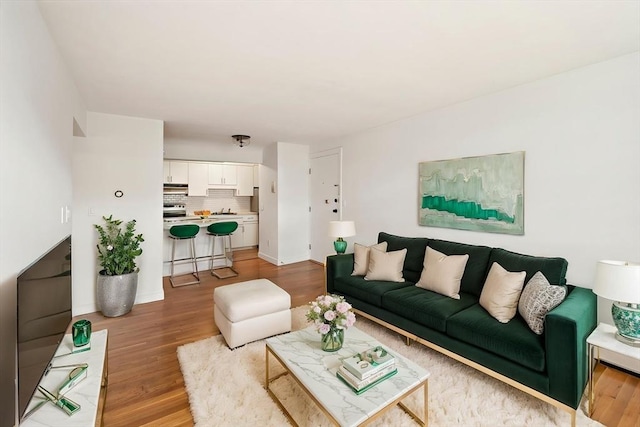 12 Commonwealth Ct Unit 12-16, Boston, MA 02135 - living area with light wood-style floors and baseboards